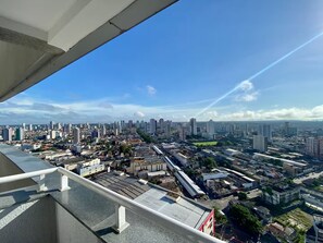 A cityscape with high-rise buildings, a mix of residential and commercial structures, and a clear sky. - 2802 Unique · Studio Unique with garage (Sacramenta)