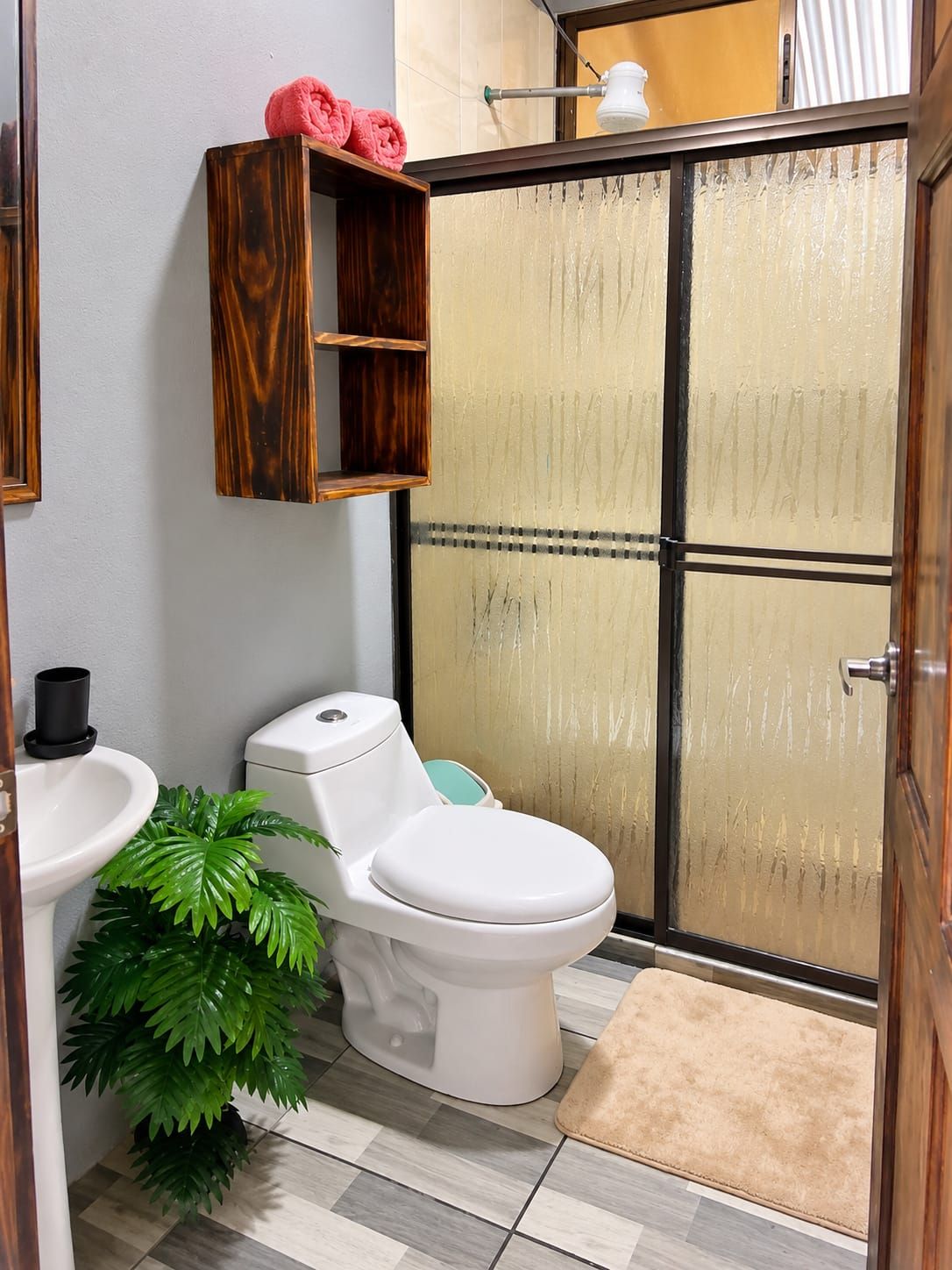 Shower, towels, soap, toilet paper