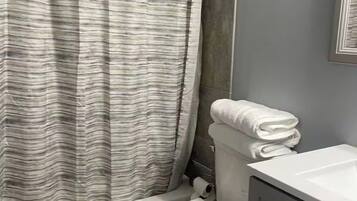 Hair dryer, towels, soap, toilet paper