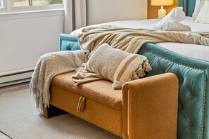 A hotel room with a sofa, a bed, and a window. - Poconos Home | Hot Tub, Cold Plunge & Fire Pit (Long Pond)