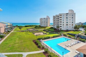 A resort with a swimming pool, a beach view, and a well-maintained lawn. - 6th-Floor Oceanview Condo w/ Beautiful Ocean & Sunrise Views (Emerald Isle)