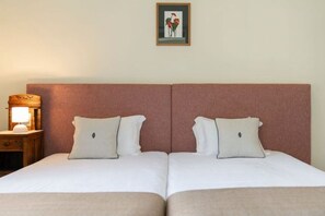 A double bed with two pillows and a nightstand with a lamp. - Villa da Fajã Alta - Room No. 4 (Santana)