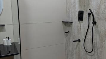 Shower, hair dryer (on request), towels, toilet paper