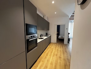 Private kitchen - 2-bedroom apartment in lovely Barcelona with AC and comfort (Barcelona)