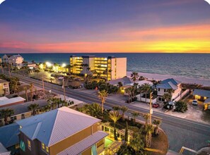A coastal hotel with multiple buildings, a beachfront, and a road leading to the beach. - Coastal Cabana• Private Pool• Ocean View• Near 30A (Panama City Beach)