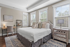 A bedroom with a large bed, a desk, a chair, and a dresser. - 🌴Sea Esta | 4BR Coastal Retreat | Golf Cart + 6 Bikes | NatureWalk🌴 (Santa Rosa Beach)