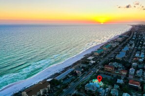 A coastal town with a beach, buildings, and a sunset. - ☀️ Summer Sun | Steps from the Beach, Private Pool & Ocean Views 🌊 (Destin)