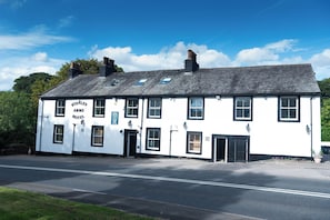 A two-story building with a sign reading 'Stanley Arms Hotel'. - The Stanley Arms Hotel by Guestz (Seascale)