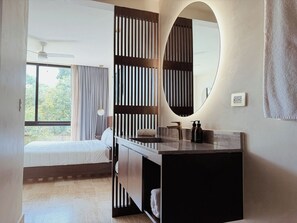 A hotel room with a bed, a bathroom with a mirror, and a window with curtains. - 2 bedrooms Penthouse w/ Private jungle terrace (Tulum)