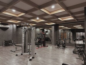 A gym with various exercise equipment, including a Cybex machine, treadmills, and free weights. - Private terrace with jungle views (Tulum)