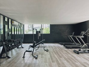 A gym with treadmills, dumbbells, and weight machines. - Main Street to the beach | Coba Av. (Tulum)