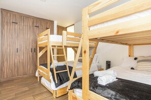 A bunk bed room with a wooden ladder, a wardrobe, and a heater. - Please note: electricity is not included in reservations longer than 28... (Tulum)
