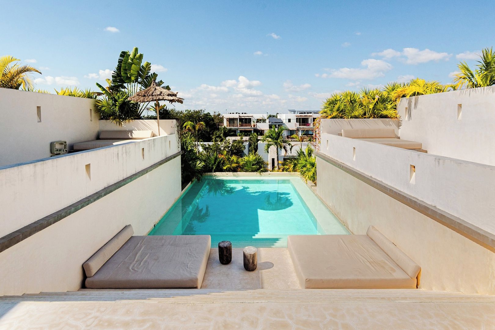 A swimming pool with a view of a building in the background.