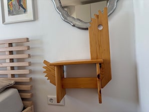A wall-mounted wooden shelf with a mirror above it. - Bled Castle & Lake View Apartment (Bled)