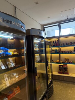 A MiniMart with refrigerated sections and shelves stocked with various products. - Spectacular apartment, well located, close to the city's shopping malls. (Salvador)