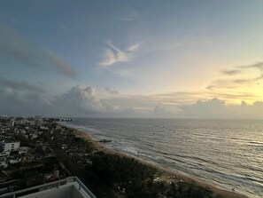 A coastal cityscape with a view of the ocean and a beach. - Premium Luxury Apartment.Prime location (Dehiwala-Mount Lavinia)