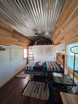 A compact room with a bed, a desk, and a window. - Adventure by day, Stargazing by night , unplug under the Big Bend Stars
 (Terlingua)