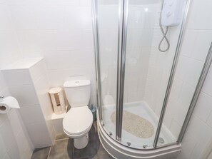 A bathroom with a glass-enclosed shower, a toilet, and a bidet. - 87 Atlantic Reach (St. Columb Major)