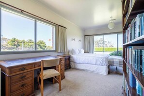 A bedroom with a desk, a bed, and a bookshelf. - Viewbank Homestead A Sprawling Garden Estate (Shoreham)