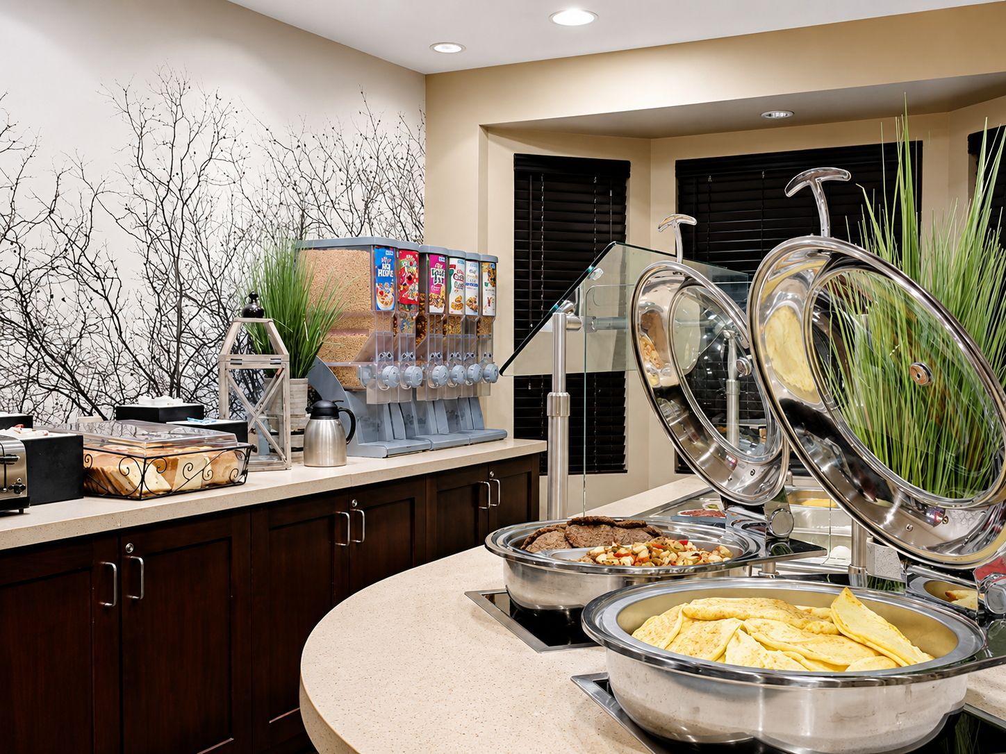 A buffet setup with various food items and a beverage dispenser.