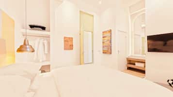 A modern bedroom with a large bed, a hanging light fixture, a wardrobe, and a bathroom with a mirror and sink.
