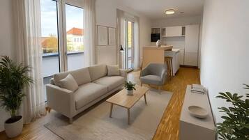 Ein modernes Wohnzimmer mit Sofa, Couchtisch und einem Essbereich mit Stuhl.