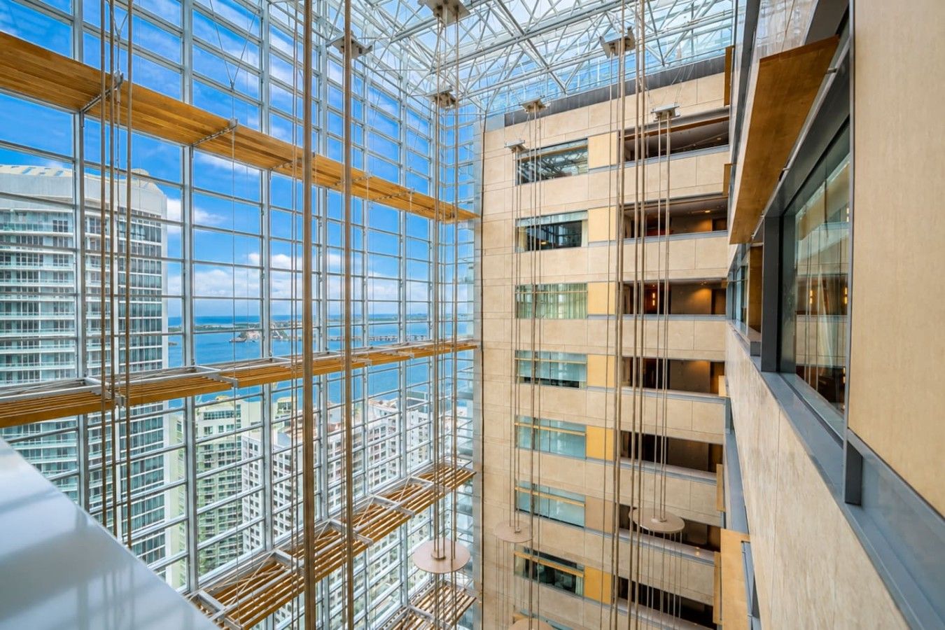A high-rise building with a glass facade and multiple floors.