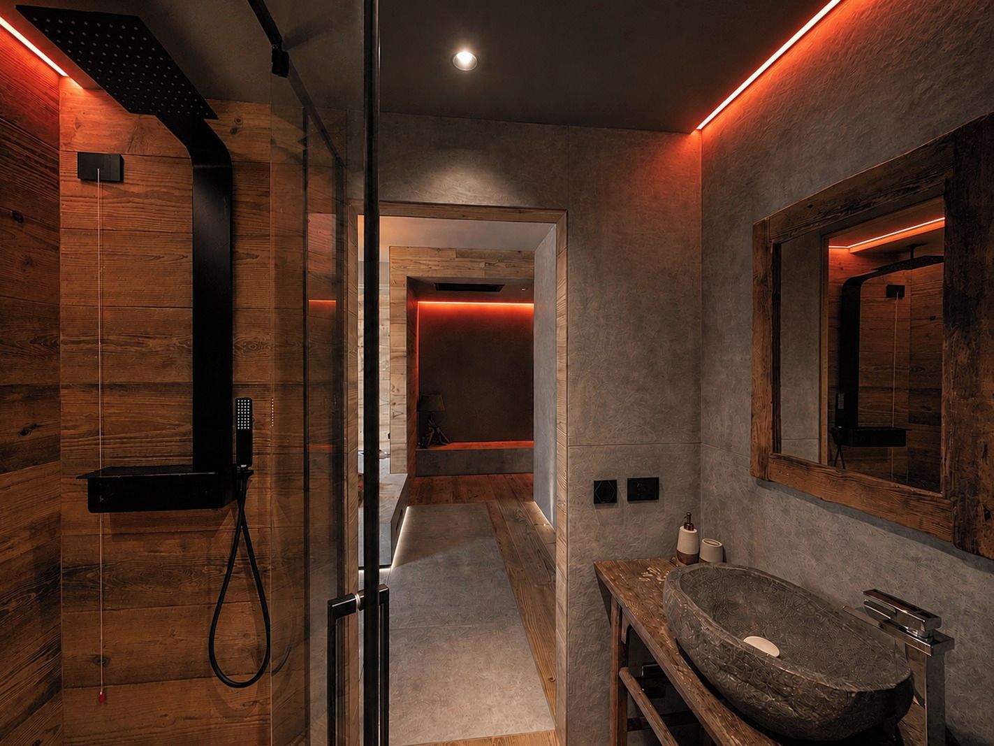 A modern bathroom with a wooden interior, a glass shower enclosure, and a large freestanding sink.