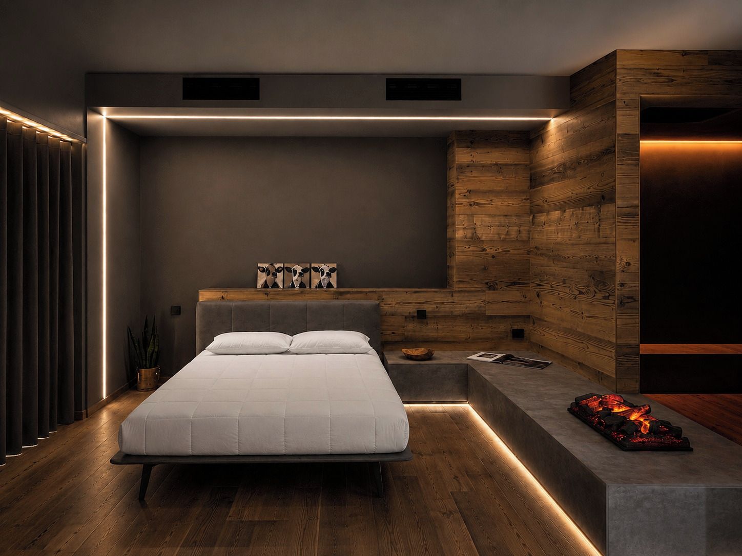 Une chambre à coucher moderne avec un lit, des tables de chevet et une cheminée intégrée.