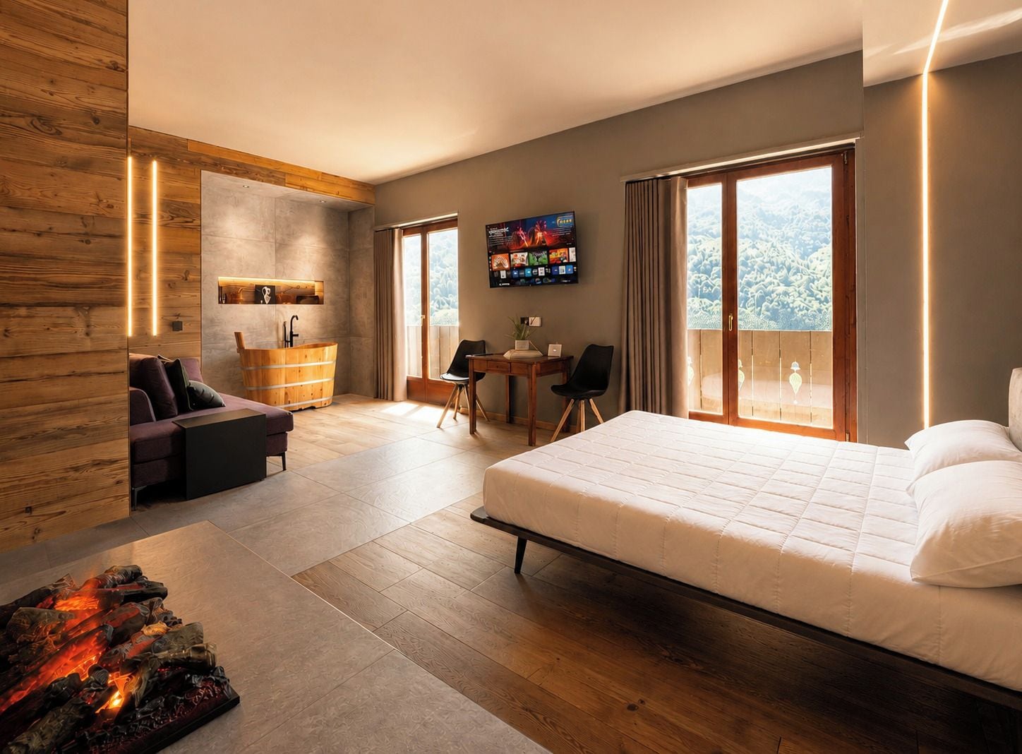Une chambre d’hôtel moderne avec un grand lit, une armoire en bois, un bureau et un téléviseur.