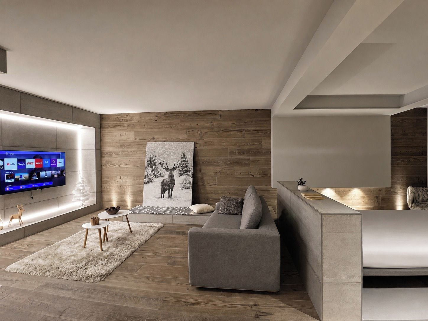 A modern living room with a flat-screen TV, a gray sofa, a wooden accent wall, and a large deer painting.