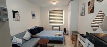 Rozhel Cozy Studio | 8 Spatial Davao | Fast WiFi | Netflix | Pool & Gym