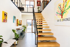 A staircase with wooden steps and a metal railing, leading to a second-floor landing. - Private+Home+Oceanviews+Pool+Jacuzzi Getaway Near Valle de Guadalupe (Ensenada)