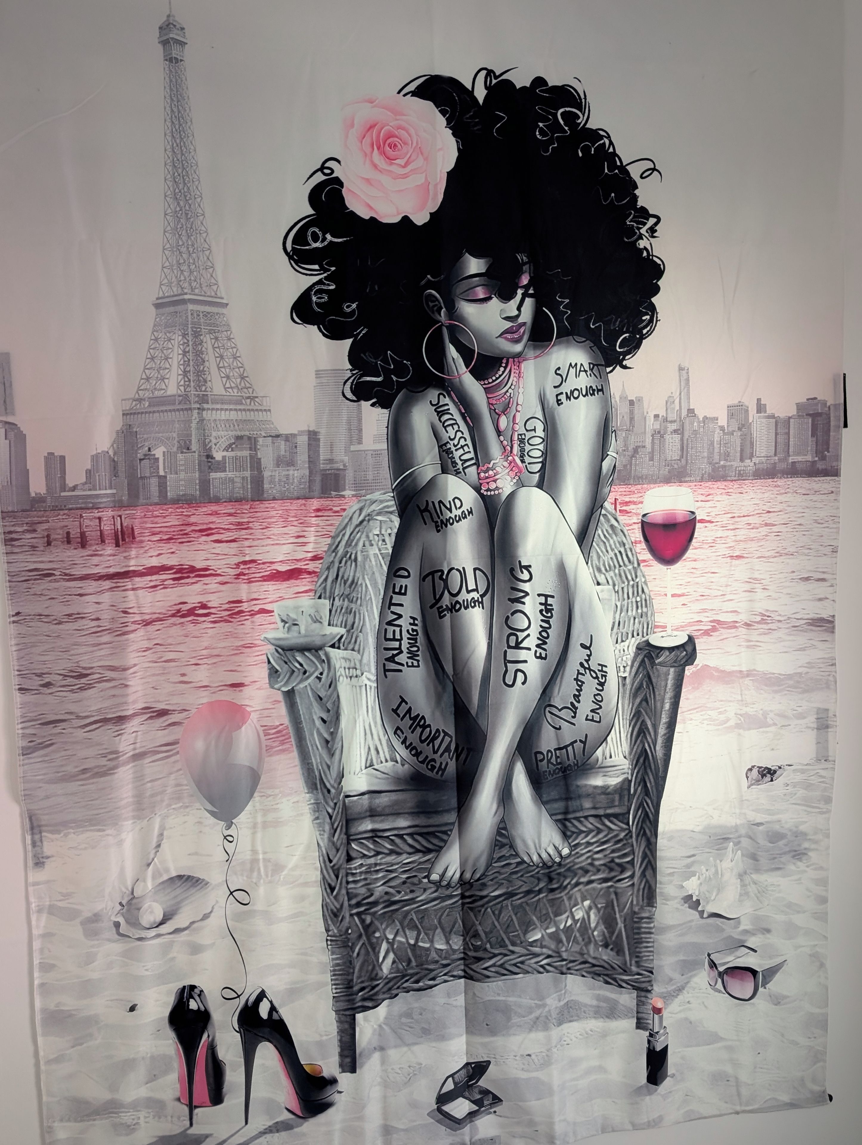 A person sitting on a chair with a cityscape and Eiffel Tower in the background.