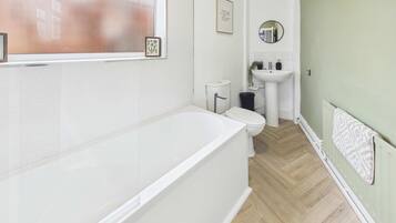 Shower, hair dryer, towels, shampoo