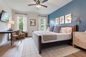 A bedroom with a bed, desk, chair, dresser, and a ceiling fan. - Trailfront Ride & Reel - Upscale Retreat 4bd/2.5ba Sleeps 10 - HOT TUB! (Bella Vista)