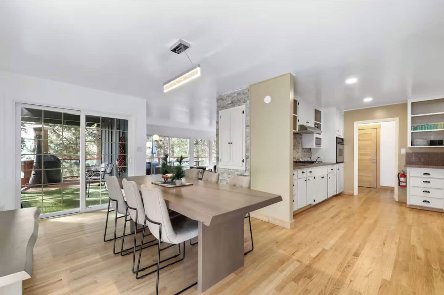 Sliding doors that lead straight to the patio and BBQ and access to living room+ kitchen