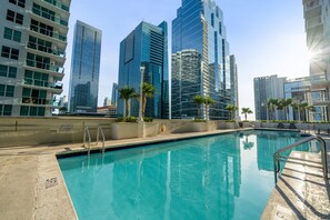 A swimming pool with a view of high-rise buildings in the background. - Relaxing Cloud 9, Central Brickell Location (Miami)