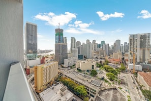 A cityscape with high-rise buildings, a clear sky, and a busy street. - Aura Studio, Heart of Miami With Resort Amenities (Miami)