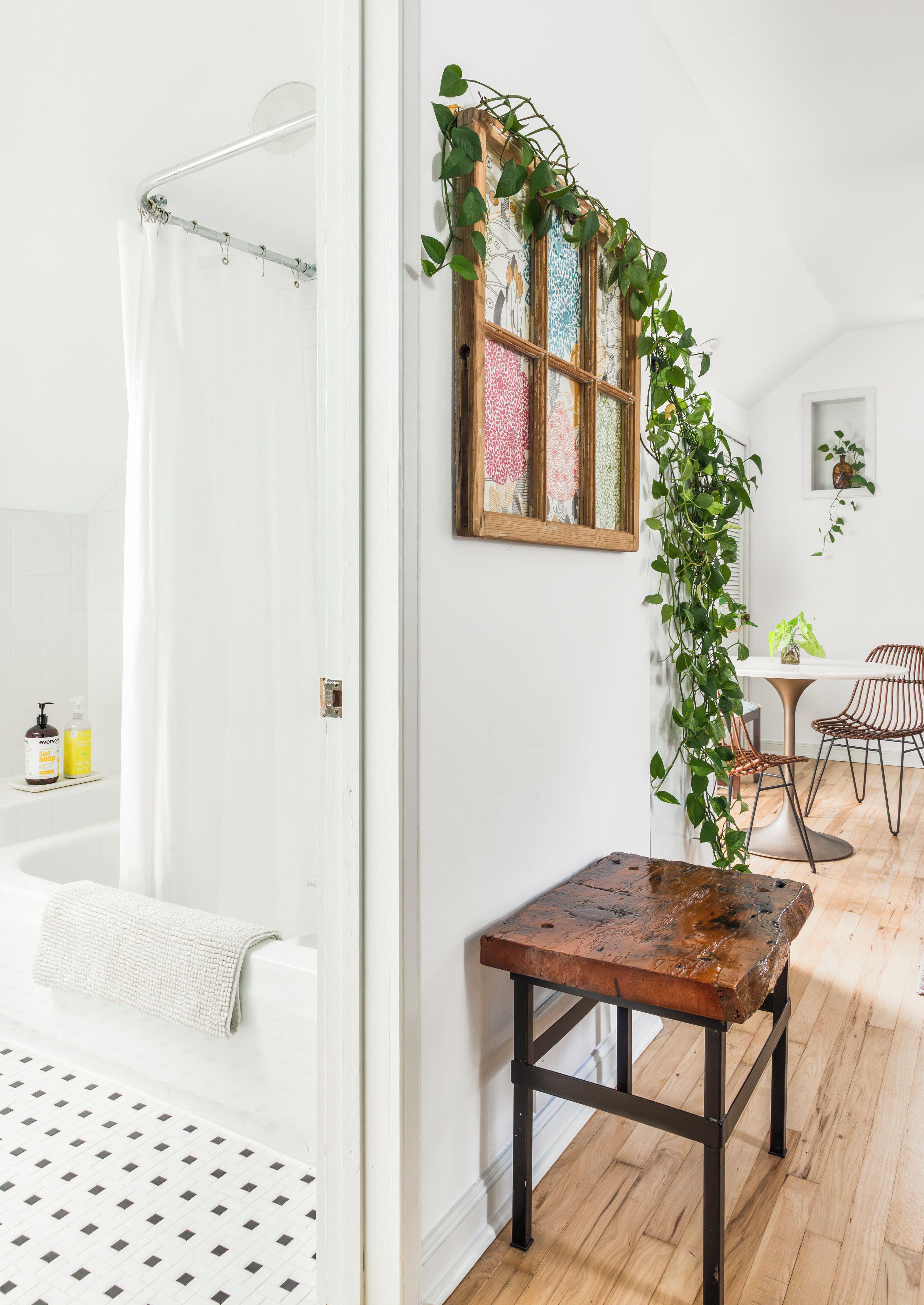 Bright hallway with spa-like bath, greenery, and warm rustic touches
