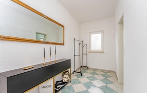 A bathroom with a vanity, mirror, and a towel rack. - Gorgeous home in Pridraga with private swimming pool, can be inside or outside (Pridraga)