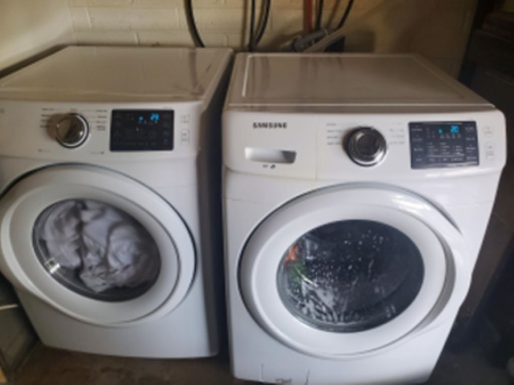 Two front-loading washing machines side by side.