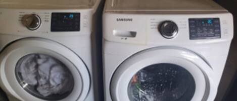 Two front-loading washing machines side by side.