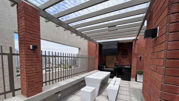 An outdoor patio with a pergola, seating, and a grill area. - 2BR/2B Suite, A/C and heating, Parking (Estación Central)