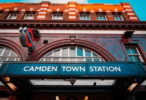 A historic building with a prominent 'Camden Town Station' sign. - 2/3 Bedroom Duplex House, 2-minute walk from Camden Town tube Station, Sleeps 6 (London)