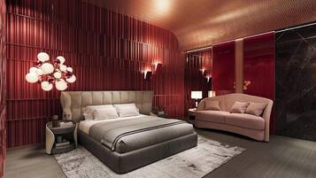 A modern bedroom with a large bed, a sofa, and a unique wall design.