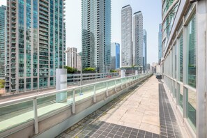A modern urban walkway with high-rise buildings on either side. - StayToronto - Union Station & Waterfront (Toronto)