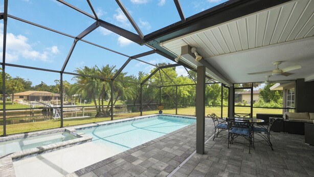 Unclassified image, 1 of 33, button - Waterfront 2BR · Heated Saltwater Pool & Spa · Dock + 10K Boat Lift (Port Charlotte)