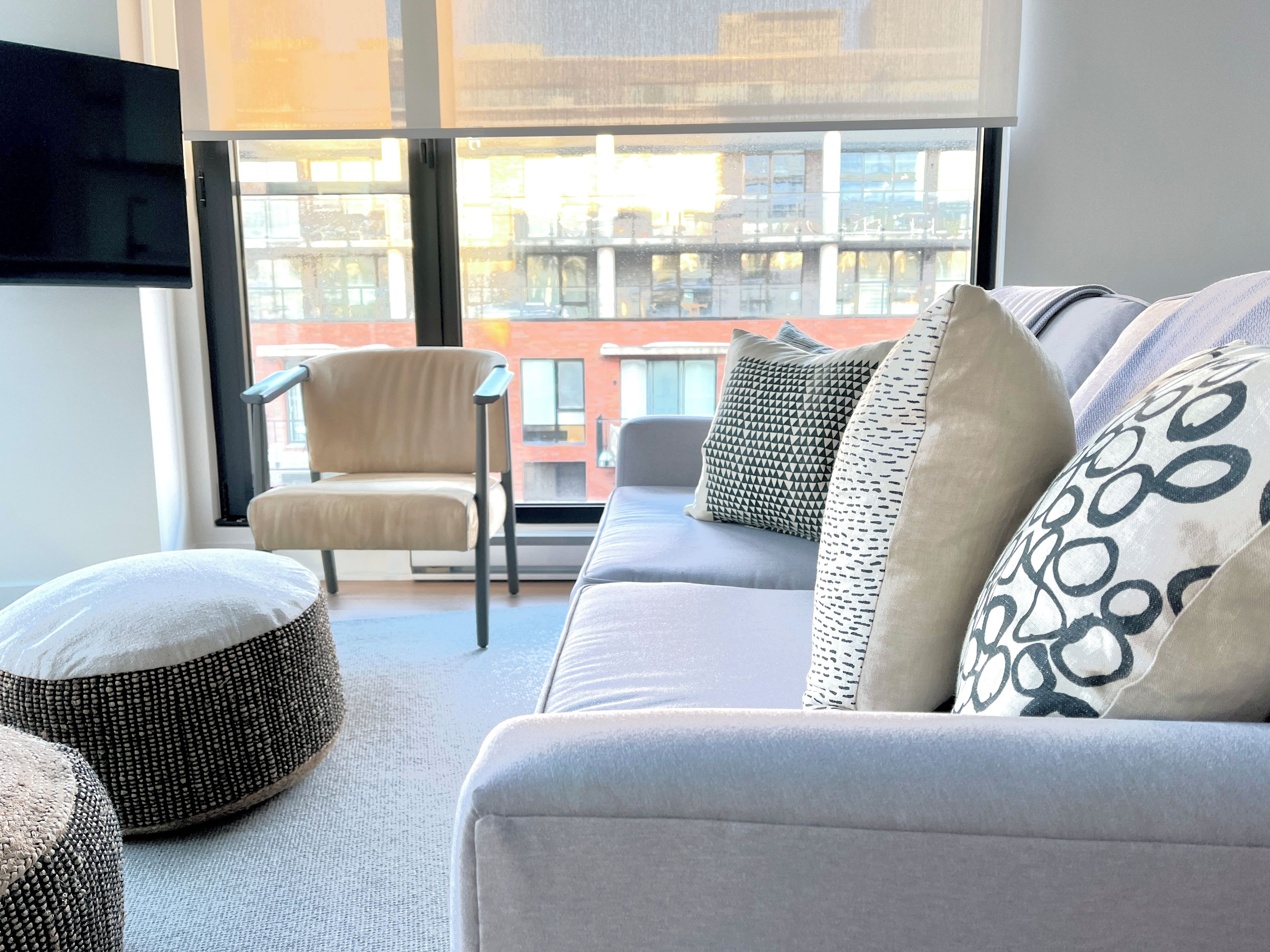 NE city windows and SE canal terrace paired with custom privacy blinds