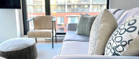 NE city windows and SE canal terrace paired with custom privacy blinds
